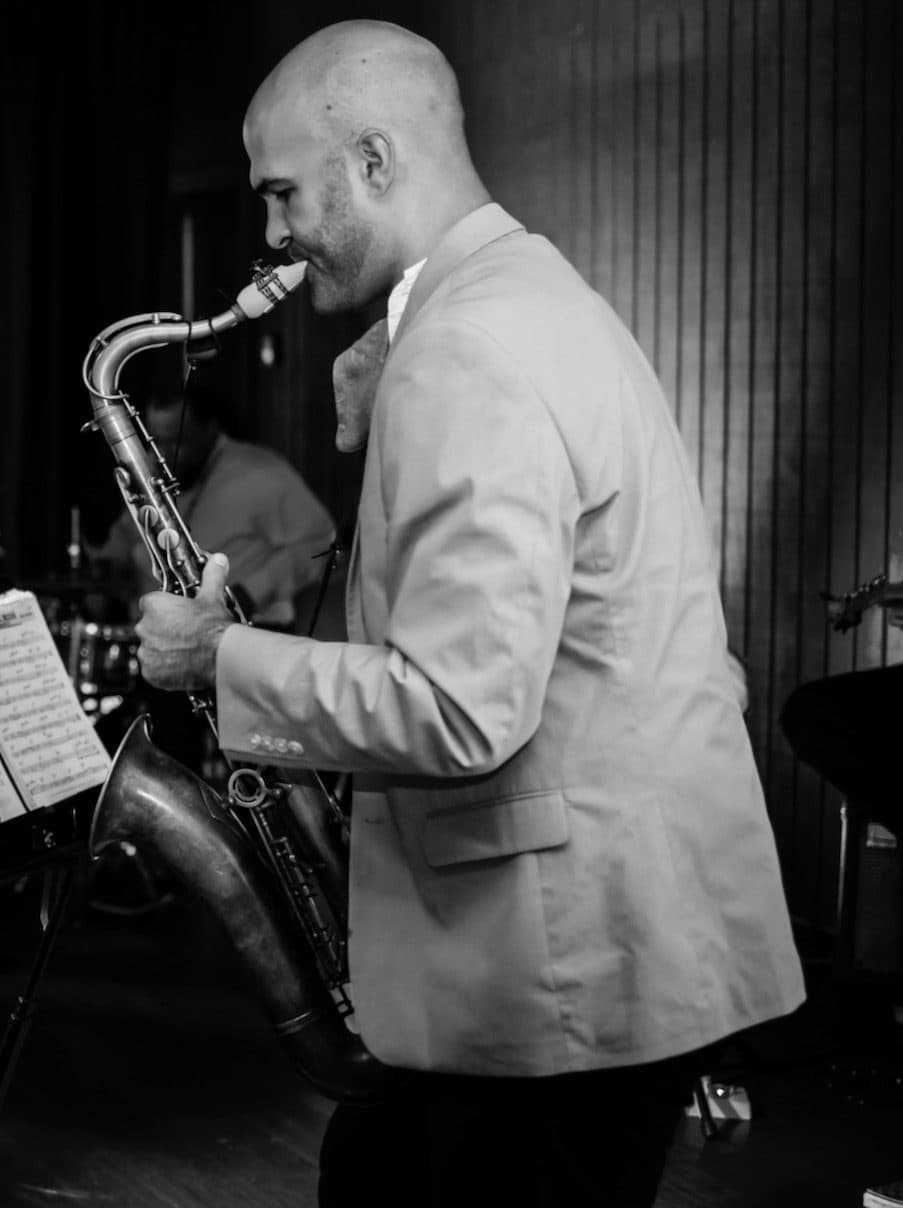 Jason James Moore playing saxophone